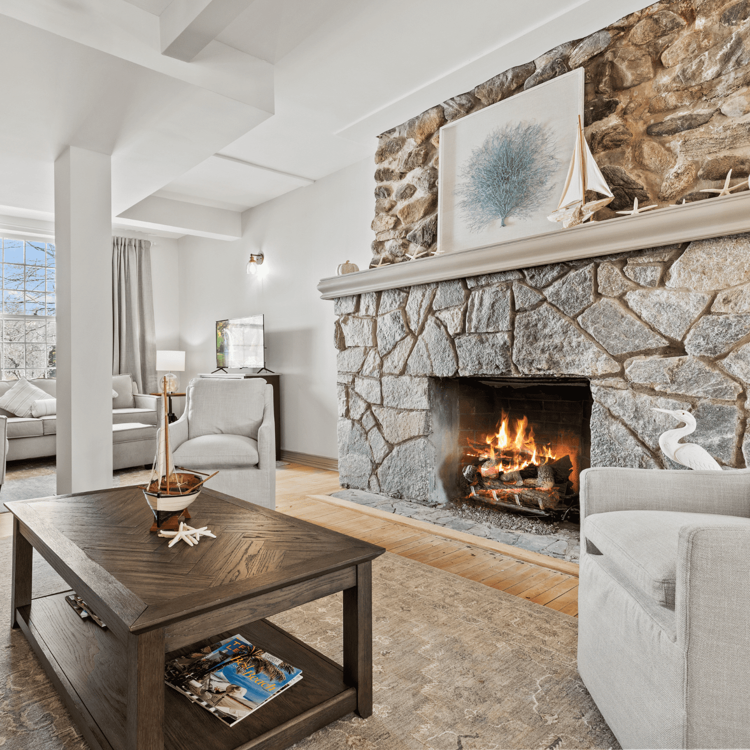 Image of great room with fireplace and coffee table